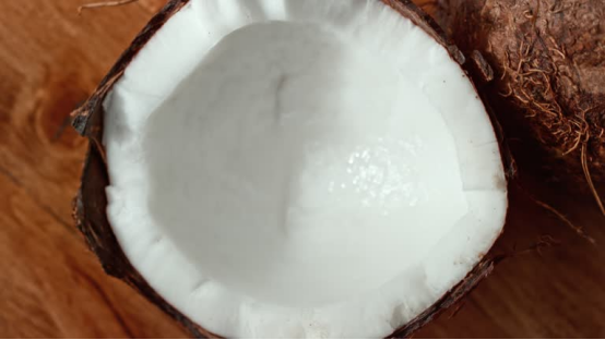 This coconut’s oil fuels the hair wax stick that tames the outdoor girl’s long hair all day.